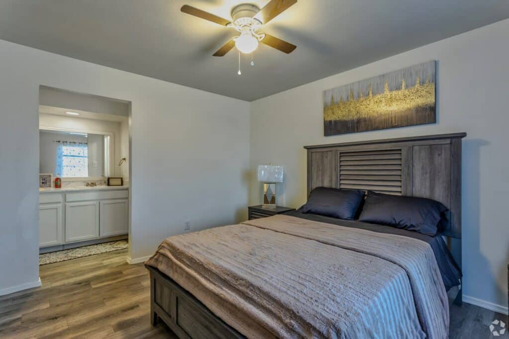 Remodeled bedroom with access to bathroom.